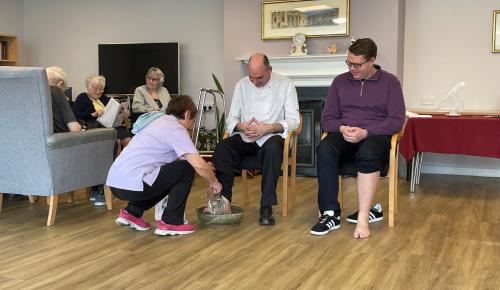 Staff and Chaplain at Corton House, a care home in Norwich with a Christian ethos, during the Maundy Thursday foot washing service.